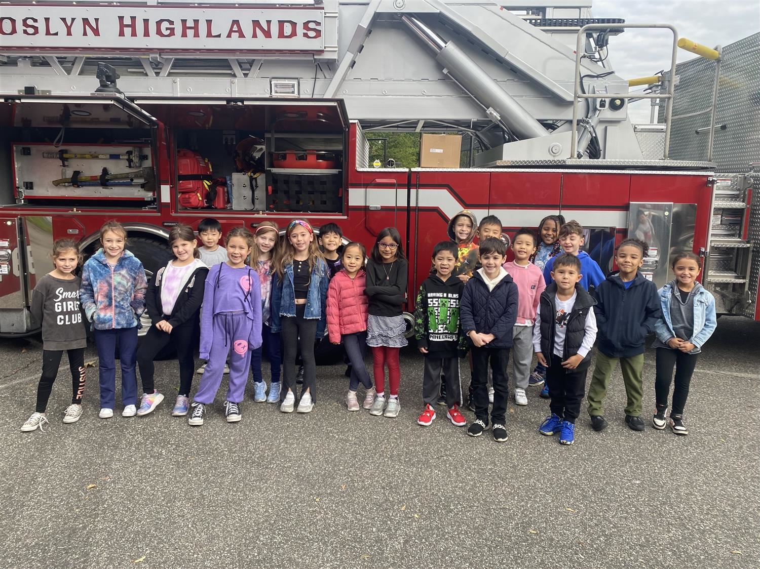  class in front of fire truck